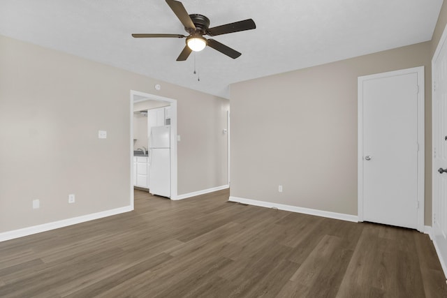 340 Wise Dr, Wilmore, KY 40390 - unfurnished bedroom featuring freestanding refrigerator, wood finished floors, baseboards, and a ceiling fan