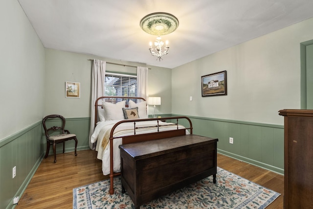 2310 Tulsa Rd, Lexington, KY 40503 - bedroom featuring wood finished floors, a wainscoted wall, and a chandelier
