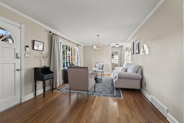 2310 Tulsa Rd, Lexington, KY 40503 - living room featuring wood finished floors, crown molding, and baseboards