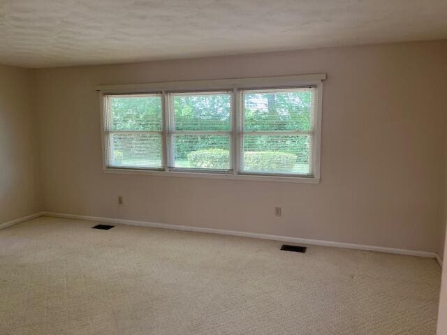 1819 N 27th Hwy, Cynthiana, KY 41031 - spare room featuring baseboards and light carpet
