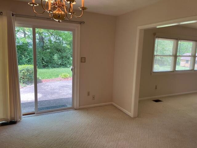 1819 N 27th Hwy, Cynthiana, KY 41031 - doorway to outside with a chandelier, carpet flooring, plenty of natural light, and baseboards