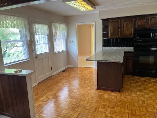 1819 N 27th Hwy, Cynthiana, KY 41031 - kitchen with black appliances, plenty of natural light, dark brown cabinets, and light countertops