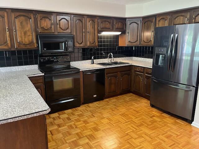 1819 N 27th Hwy, Cynthiana, KY 41031 - kitchen with black appliances, a sink, light countertops, dark brown cabinets, and tasteful backsplash