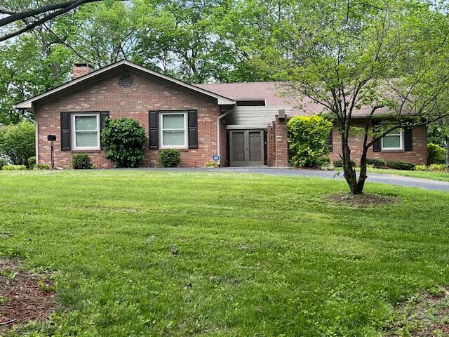 1819 N 27th Hwy, Cynthiana, KY 41031 - ranch-style home with a chimney, brick siding, a front lawn, and french doors