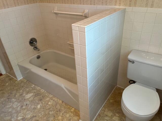 1819 N 27th Hwy, Cynthiana, KY 41031 - bathroom with wallpapered walls, toilet, and tile walls