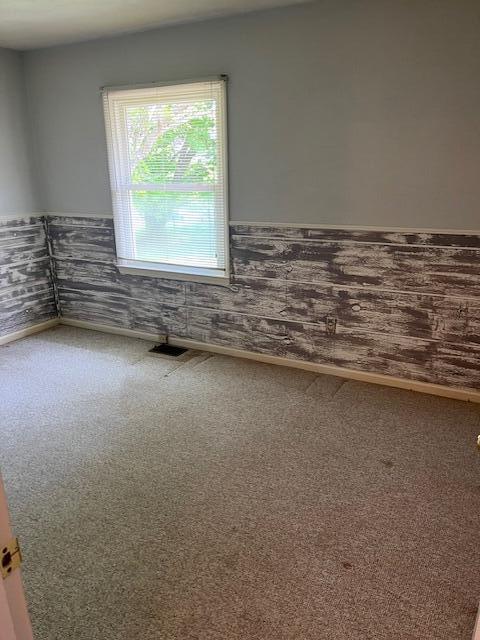 1819 N 27th Hwy, Cynthiana, KY 41031 - spare room featuring carpet flooring and a wainscoted wall