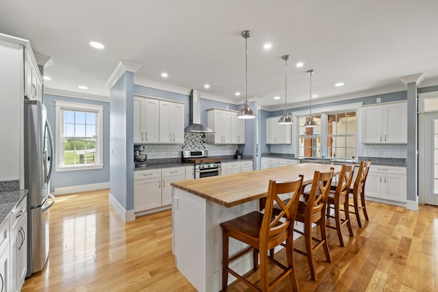 324 Hays Mays Rd, Perryville, KY 40468 - kitchen with stainless steel appliances, wall chimney exhaust hood, crown molding, decorative backsplash, and wood counters