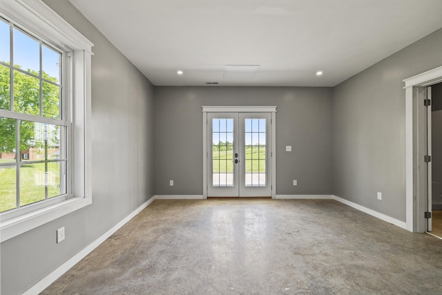 324 Hays Mays Rd, Perryville, KY 40468 - unfurnished room featuring french doors, concrete floors, baseboards, and recessed lighting