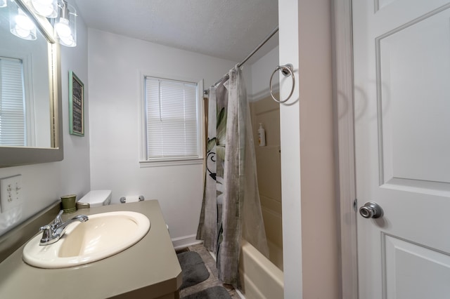 bathroom featuring vanity and shower / bath combination with curtain