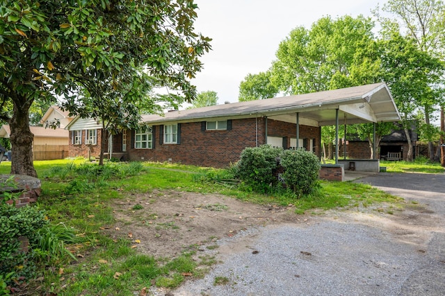 3202 W Cumberland Ave, Middlesboro, KY 40965 - view of front of house featuring brick siding and asphalt driveway