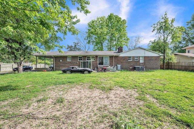 3202 W Cumberland Ave, Middlesboro, KY 40965 - rear view of property with brick siding, a chimney, and cooling unit