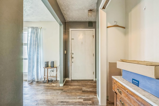 3202 W Cumberland Ave, Middlesboro, KY 40965 - entryway featuring wood finished floors and a textured ceiling