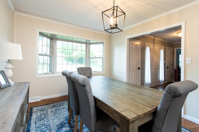 3476 Grasmere Dr, Lexington, KY 40503 - dining room featuring a chandelier, dark wood-style flooring, baseboards, and ornamental molding