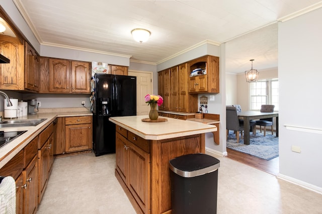 3476 Grasmere Dr, Lexington, KY 40503 - kitchen with black refrigerator with ice dispenser, a sink, brown cabinets, light countertops, and crown molding