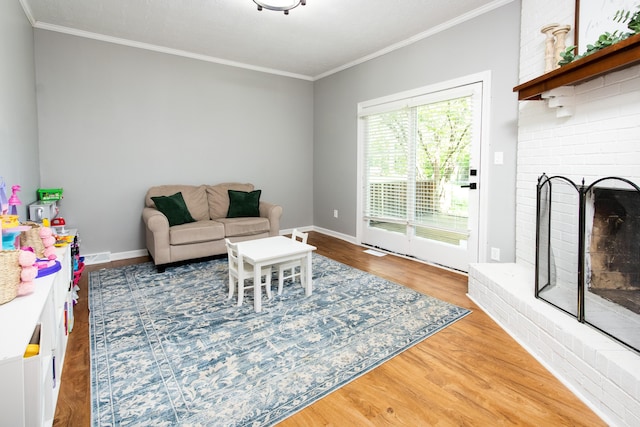 3476 Grasmere Dr, Lexington, KY 40503 - living room with ornamental molding, wood finished floors, a brick fireplace, and baseboards