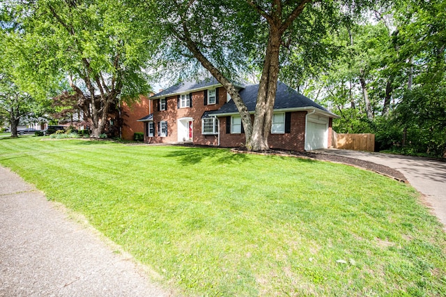 3476 Grasmere Dr, Lexington, KY 40503 - colonial house featuring driveway, an attached garage, brick siding, and a shingled roof