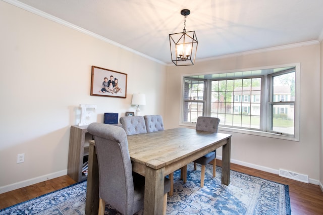 3476 Grasmere Dr, Lexington, KY 40503 - dining room with ornamental molding, a chandelier, wood finished floors, and baseboards