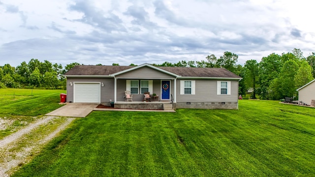 view of front of house with driveway, covered porch, an attached garage, a front yard, and crawl space