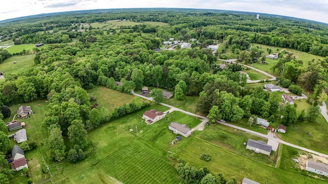 aerial overview of property's location featuring a heavily wooded area