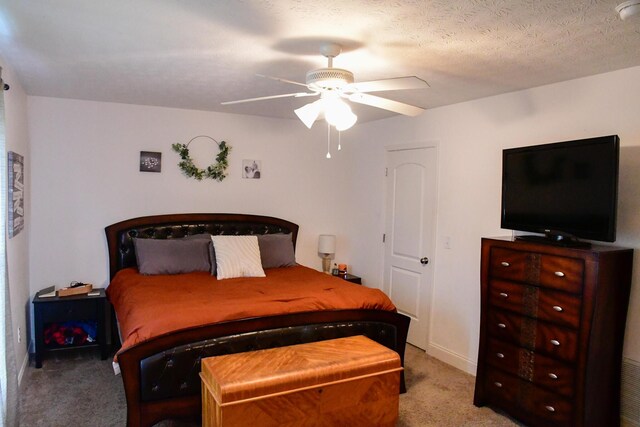 bedroom featuring light carpet and ceiling fan