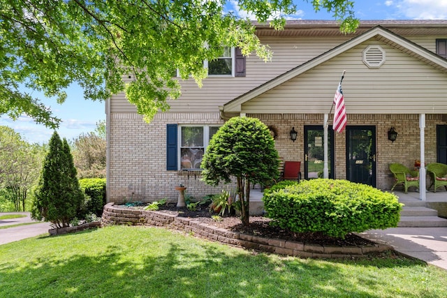 129 Bay Hill Dr, Winchester, KY 40391 - view of front facade featuring a porch, brick siding, and a front lawn