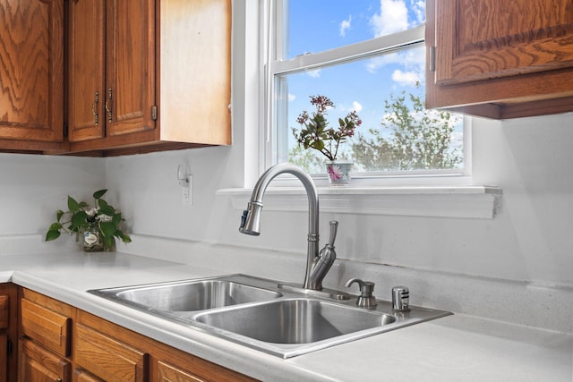 129 Bay Hill Dr, Winchester, KY 40391 - kitchen with a sink, brown cabinets, and light countertops