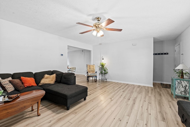 129 Bay Hill Dr, Winchester, KY 40391 - living area featuring light wood finished floors, a ceiling fan, and baseboards