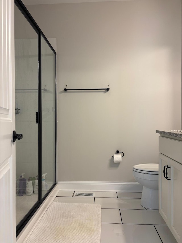 875 Ridgeview Dr, Frankfort, KY 40601 - full bathroom featuring tile patterned flooring, a shower stall, vanity, toilet, and baseboards