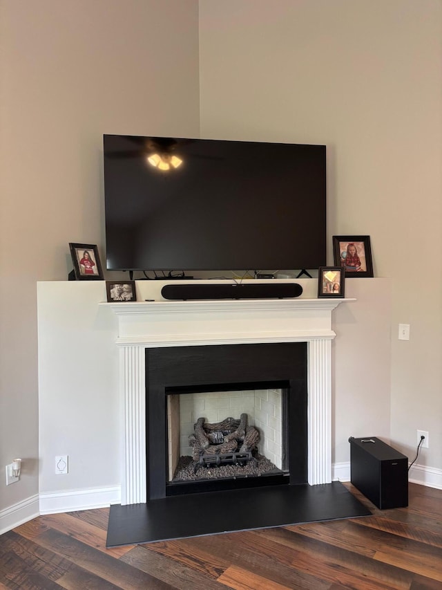 875 Ridgeview Dr, Frankfort, KY 40601 - detailed view of a fireplace with raised hearth, wood finished floors, and baseboards