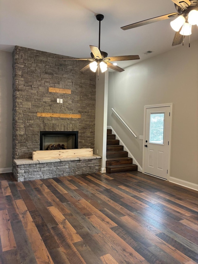 875 Ridgeview Dr, Frankfort, KY 40601 - unfurnished living room featuring a ceiling fan, stairway, a stone fireplace, baseboards, and wood finished floors