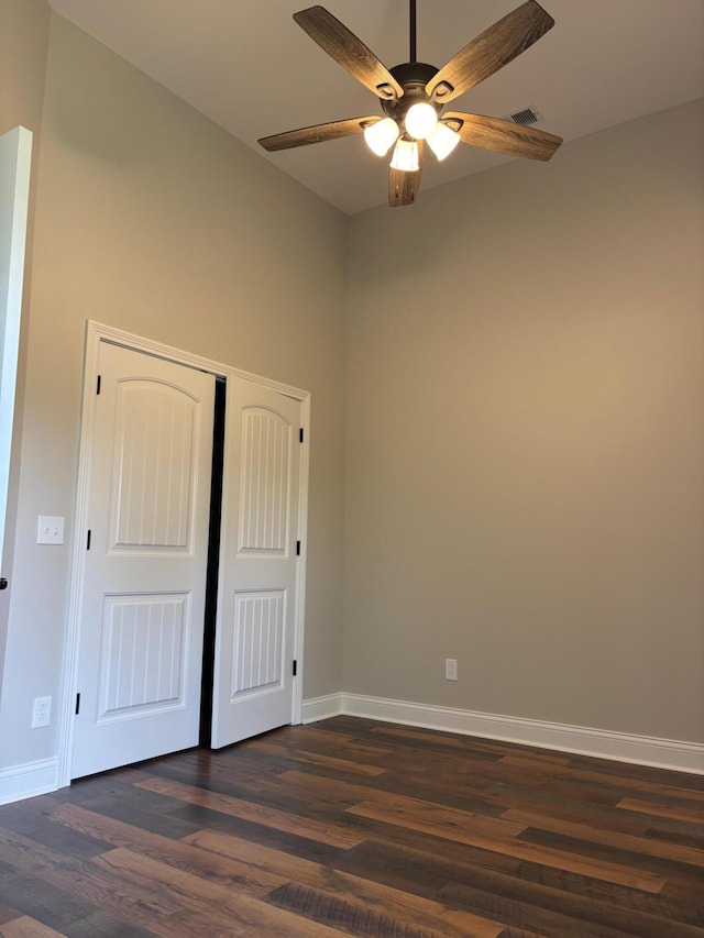 875 Ridgeview Dr, Frankfort, KY 40601 - unfurnished bedroom with dark wood-style flooring, baseboards, and a closet