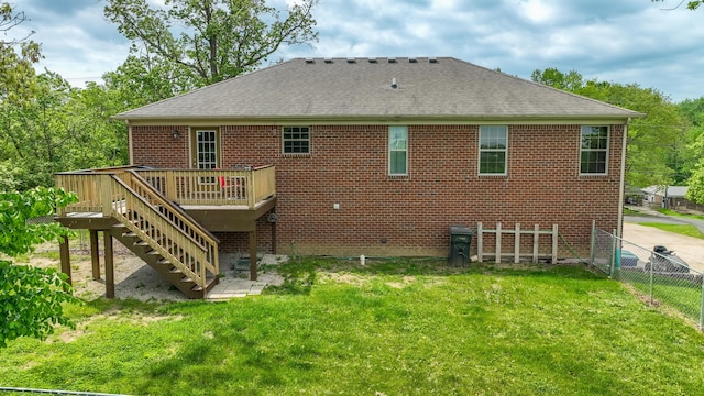 back of house featuring a deck, a shingled roof, brick siding, and stairway