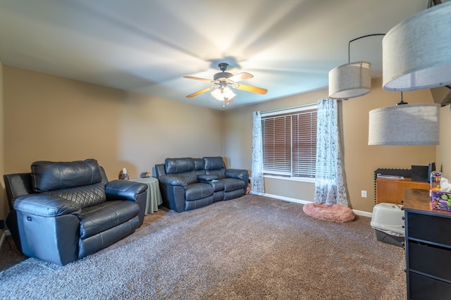 living room featuring carpet flooring, ceiling fan, and baseboards