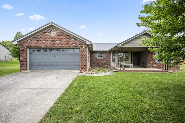 ranch-style home with a front lawn, driveway, a garage, and brick siding