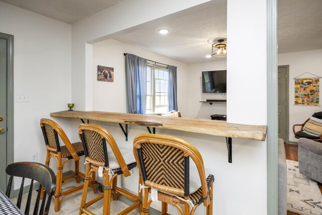 dining area featuring a textured ceiling