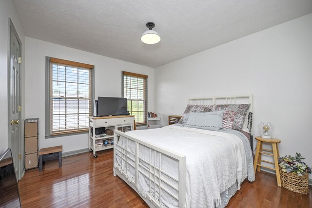 bedroom with wood finished floors