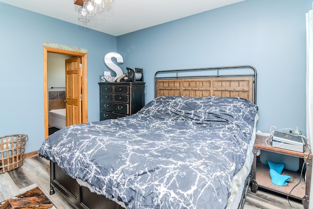 bedroom with wood finished floors