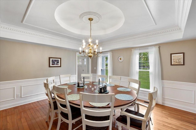 1183 The Ridings, Winchester, KY 40391 - dining area with a tray ceiling, wood finished floors, a wainscoted wall, a chandelier, and a decorative wall