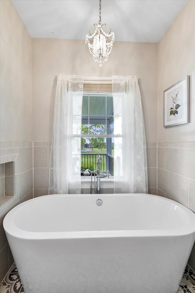 1183 The Ridings, Winchester, KY 40391 - full bath featuring tile walls, a chandelier, and a freestanding bath
