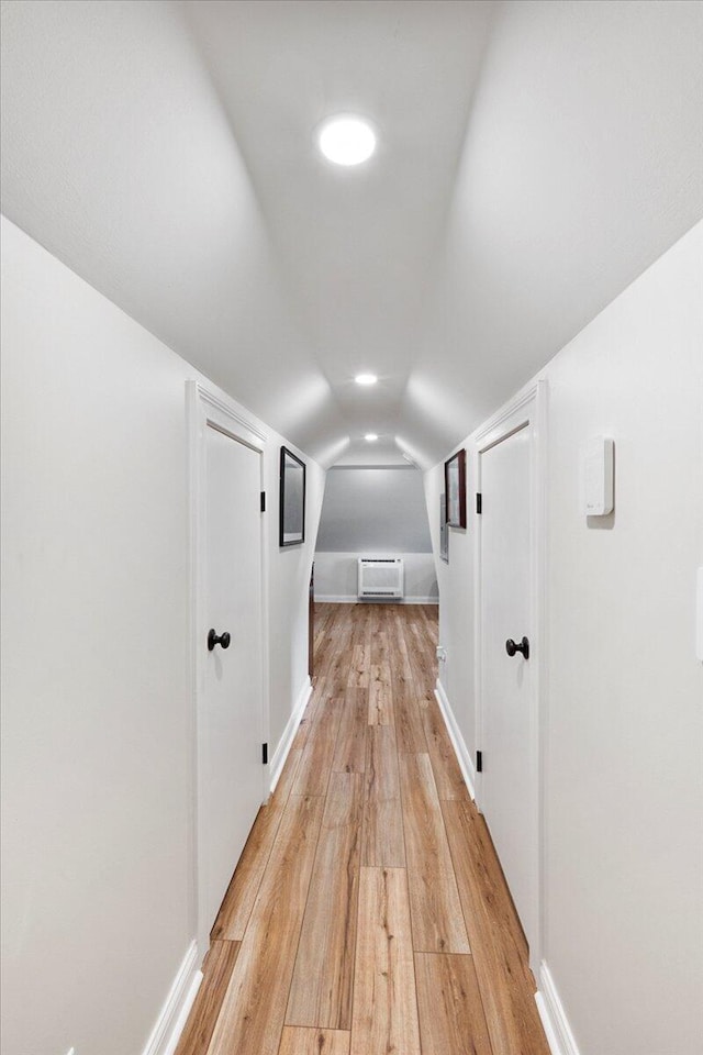 1183 The Ridings, Winchester, KY 40391 - hallway featuring light wood-style flooring, vaulted ceiling, a wall mounted AC, and baseboards