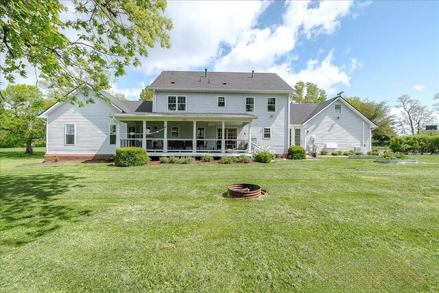 1183 The Ridings, Winchester, KY 40391 - back of house featuring a fire pit and a lawn