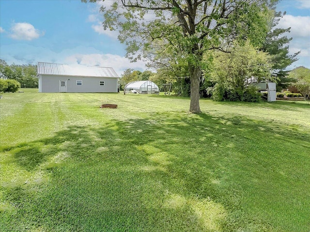 1183 The Ridings, Winchester, KY 40391 - view of grassy yard with an exterior structure and an outbuilding