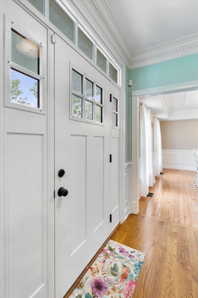 1183 The Ridings, Winchester, KY 40391 - foyer entrance with light wood-style floors, crown molding, a decorative wall, and a wainscoted wall
