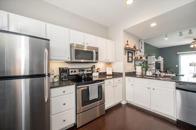 2627 Calgary, Lexington, KY 40509 - kitchen with stainless steel appliances, white cabinetry, a sink, and rail lighting