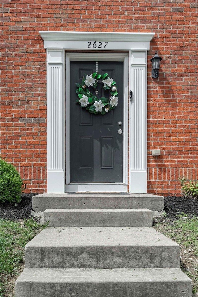 2627 Calgary, Lexington, KY 40509 - doorway to property featuring brick siding