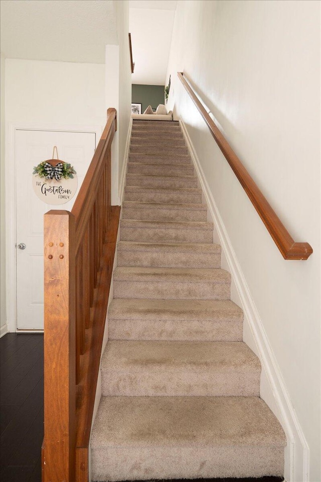 2627 Calgary, Lexington, KY 40509 - stairway with baseboards and wood finished floors