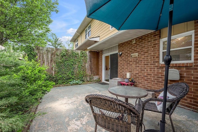 view of patio featuring fence