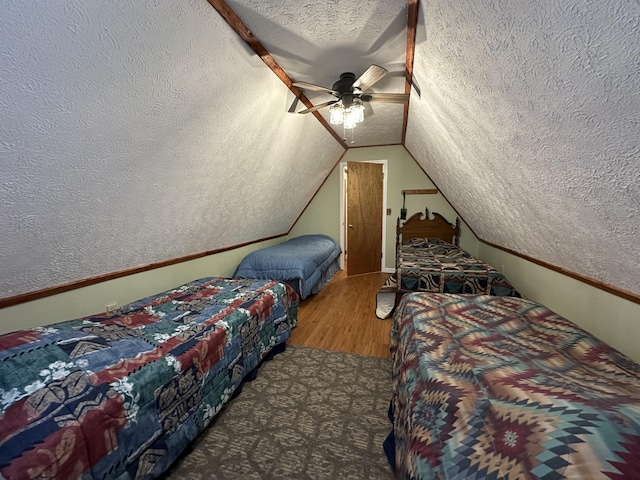 100 Buck Dr, Wellington, KY 40387 - bedroom featuring a textured ceiling, wood finished floors, lofted ceiling, and a ceiling fan