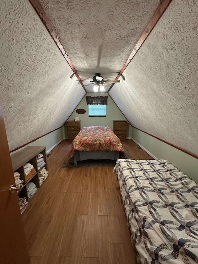 100 Buck Dr, Wellington, KY 40387 - bedroom with a textured ceiling, wood finished floors, ceiling fan, lofted ceiling, and baseboards