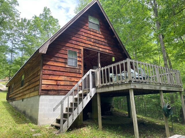 100 Buck Dr, Wellington, KY 40387 - back of property featuring a deck and stairway